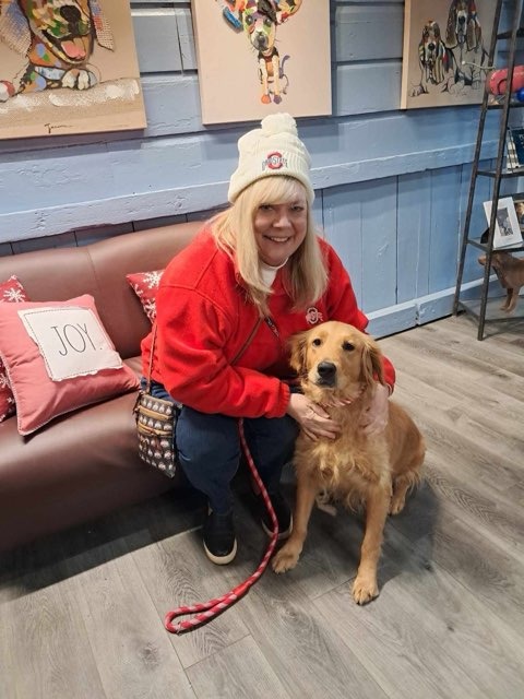 Oakley just adopted from Operation Saves, sitting iwth her new owner