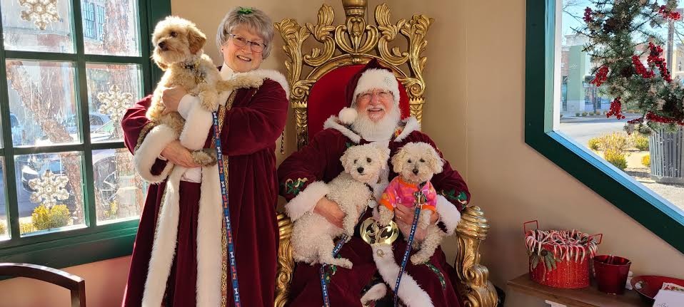 Sid with his furry brothers taking holiday picture with Mr. & Mrs. Clause
